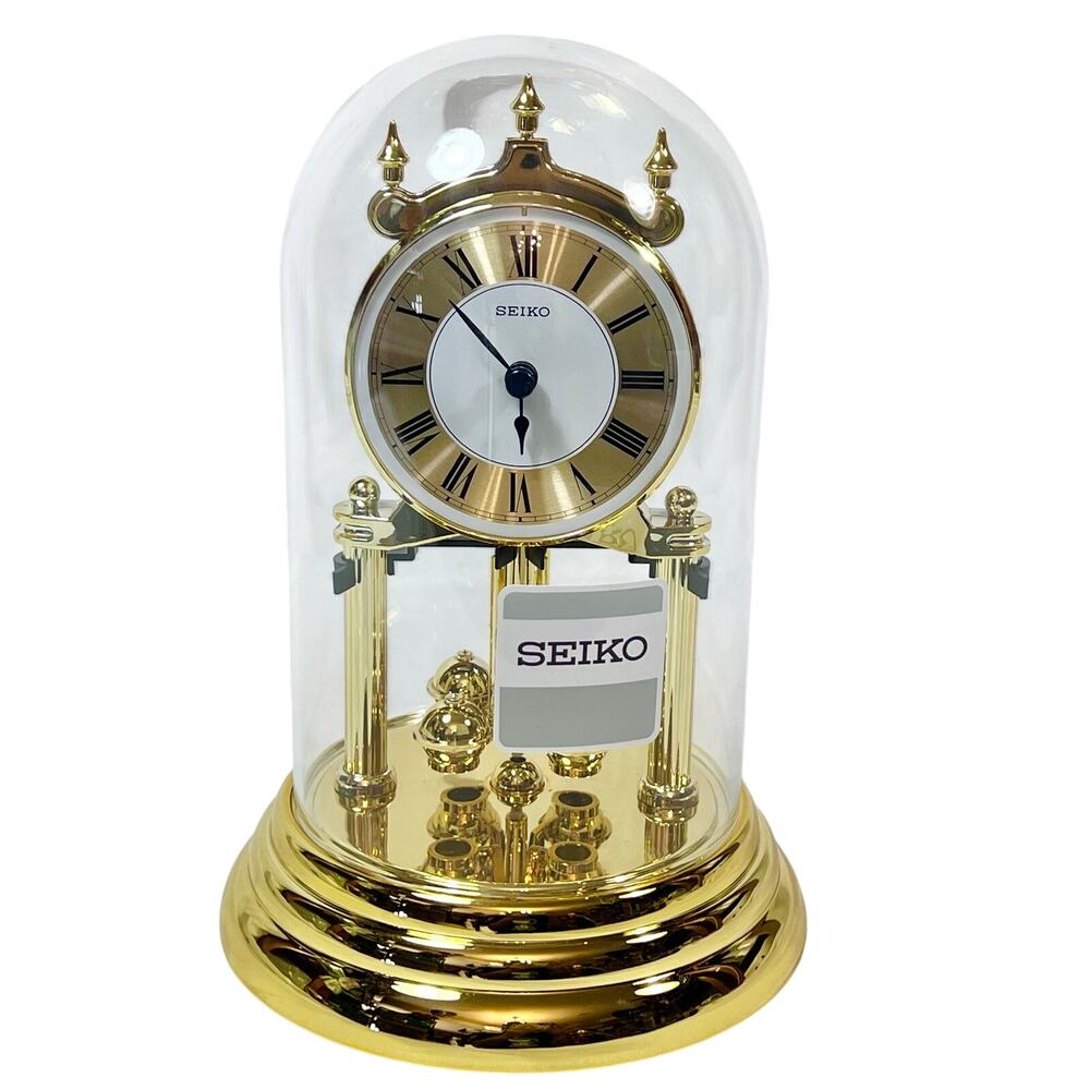 Seiko Anniversary Clock Gold Tone Rotating Pendulum Glass Cover Analog Quartz